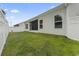 Landscaped backyard features green grass, fenced perimeter and screened in patio at 2405 Capri Court, Conway, SC 29527