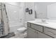 Clean bathroom featuring a shower-tub combo and vanity with gray cabinets at 2405 Capri Court, Conway, SC 29527