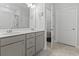 Bright bathroom featuring double sink vanity and doorway to water closet at 2405 Capri Court, Conway, SC 29527