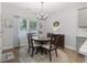 Cozy dining area with a round table, chandelier, and natural light at 2405 Capri Court, Conway, SC 29527