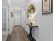 Hallway with wood floors and neutral walls that give an inviting feel at 2405 Capri Court, Conway, SC 29527