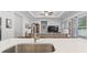 Open concept kitchen with an island and views of the living room at 2405 Capri Court, Conway, SC 29527