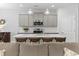 Open-concept kitchen featuring a large island with bar seating, stainless steel appliances, and ample cabinet space at 2405 Capri Court, Conway, SC 29527