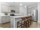 Kitchen island with grey cabinets, white countertops, and stainless steel appliances at 2405 Capri Court, Conway, SC 29527