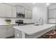 Close-up of kitchen island featuring white countertops, gray cabinets and stainless steel appliances at 2405 Capri Court, Conway, SC 29527