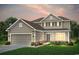 Charming two-story home featuring a welcoming entrance, well-manicured lawn, and a two-car garage at 2429 Watershed Way, Longs, SC 29568
