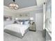 Serene main bedroom featuring a tray ceiling, soft colors, and plenty of natural light from the window at 2500 Watershed Way, Longs, SC 29568