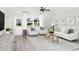 Cozy living room featuring neutral tones, comfortable seating, a ceiling fan, and lots of natural light at 2500 Watershed Way, Longs, SC 29568