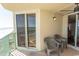 Relaxing balcony showcasing ocean views, sliding glass doors, and comfortable seating arrangements at 2507 S Ocean Blvd., North Myrtle Beach, SC 29582