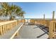 Beach access point with bench, showers, and a boardwalk offering clear ocean views at 2507 S Ocean Blvd., North Myrtle Beach, SC 29582