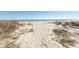 Sandy beach with dune vegetation offering a pathway to the ocean at 2507 S Ocean Blvd., North Myrtle Beach, SC 29582