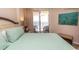 Relaxing bedroom with a king bed and access to a private balcony and ocean views at 2507 S Ocean Blvd., North Myrtle Beach, SC 29582