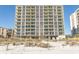 Large condo building with balconies overlooks the beach and ocean at 2507 S Ocean Blvd., North Myrtle Beach, SC 29582