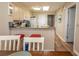 Well-lit kitchen featuring granite countertops, modern appliances, and bar stool seating arrangement at 2507 S Ocean Blvd., North Myrtle Beach, SC 29582