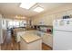 Open kitchen with granite counters and a breakfast bar overlooks the living area and ocean at 2507 S Ocean Blvd., North Myrtle Beach, SC 29582