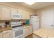 Bright kitchen with white cabinets, granite countertops, and modern appliances at 2507 S Ocean Blvd., North Myrtle Beach, SC 29582