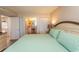 Comfortable main bedroom features a king bed, ensuite, and easy kitchen access at 2507 S Ocean Blvd., North Myrtle Beach, SC 29582