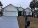Charming single-story home with well-manicured landscaping and a two-car garage at 3012 Winding River Rd., North Myrtle Beach, SC 29582
