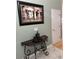 Elegant foyer with a decorative table, sculpture, and painting at 3012 Winding River Rd., North Myrtle Beach, SC 29582