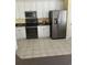 Kitchen features stainless steel appliances, white cabinets, tile floors and a neutral backsplash at 3012 Winding River Rd., North Myrtle Beach, SC 29582