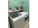 Laundry room featuring a modern washer and dryer with shelving for storage at 3012 Winding River Rd., North Myrtle Beach, SC 29582