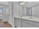 Bathroom with double sink vanity, a large mirror, and modern fixtures and finishes at 36 Cape Point Dr., Conway, SC 29527