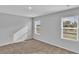 Bright bedroom with neutral walls, carpeted floor, and two windows providing ample natural light at 36 Cape Point Dr., Conway, SC 29527