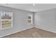 Bedroom with neutral walls and two windows bringing in sunlight, creating a cozy atmosphere at 36 Cape Point Dr., Conway, SC 29527