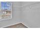 Bright closet featuring white wire shelving, neutral walls, and a large window with natural light at 36 Cape Point Dr., Conway, SC 29527