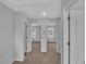 Hallway showcasing the open layout and neutral carpet, with doorways leading to multiple rooms at 36 Cape Point Dr., Conway, SC 29527