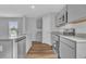 Beautiful kitchen with stainless steel appliances, granite counters, grey cabinets, and a kitchen island at 36 Cape Point Dr., Conway, SC 29527