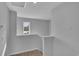 Upper level landing featuring carpeted steps and a window providing natural light to the area at 36 Cape Point Dr., Conway, SC 29527