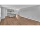 Modern living space with stylish wood floors seamlessly transitioning to a well-appointed kitchen at 36 Cape Point Dr., Conway, SC 29527