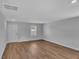 A bright living room with recessed lighting, laminate wood flooring, and white painted walls at 36 Cape Point Dr., Conway, SC 29527