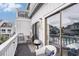 Cozy balcony featuring a grill, charming decor, and comfortable seating for outdoor enjoyment at 3700 Golf Colony Lane # 6J, Little River, SC 29566