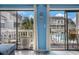 Balcony with outdoor seating overlooking a pool and surrounding buildings, offering a relaxing outdoor space at 3700 Golf Colony Lane # 6J, Little River, SC 29566