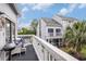 Relaxing balcony with comfortable seating and grill, perfect for enjoying the outdoor view at 3700 Golf Colony Lane # 6J, Little River, SC 29566