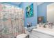 Well-lit bathroom featuring a vanity, toilet, and stylish shower curtain at 3700 Golf Colony Lane # 6J, Little River, SC 29566