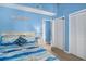 Bright bedroom featuring a closet, nightstand, and nautical decorations at 3700 Golf Colony Lane # 6J, Little River, SC 29566