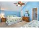 Spacious bedroom with vaulted ceiling, dresser, nightstand, and ceiling fan at 3700 Golf Colony Lane # 6J, Little River, SC 29566