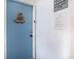 Blue front door with welcome sign and unit number at a charming coastal condo unit at 3700 Golf Colony Lane # 6J, Little River, SC 29566