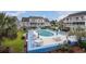 Scenic view of the outdoor pool area, surrounded by lounge seating and well-maintained grounds at 3700 Golf Colony Lane # 6J, Little River, SC 29566