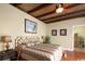 Inviting bedroom with ceiling fan, a bamboo ceiling, and warm lighting for a cozy ambiance at 3709 N Ocean Blvd., North Myrtle Beach, SC 29582