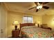 Relaxing bedroom featuring a ceiling fan, floral bedding, and bright windows for a peaceful retreat at 3709 N Ocean Blvd., North Myrtle Beach, SC 29582