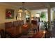 Spacious dining room with a large table, wooden chairs, and plenty of natural light throughout the area at 3709 N Ocean Blvd., North Myrtle Beach, SC 29582