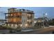 Expansive, multi-story home featuring multiple balconies and a rooftop terrace with panoramic views at 3709 N Ocean Blvd., North Myrtle Beach, SC 29582