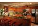 Well-equipped kitchen features granite countertops, stainless steel appliances, mosaic backsplash, and convenient bar seating at 3709 N Ocean Blvd., North Myrtle Beach, SC 29582