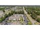 Scenic aerial view of apartments with a pond and parking lot, near a road with lush green surroundings at 3795 Hitchcock Way # 618, Myrtle Beach, SC 29577