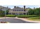 Clubhouse exterior showing the well manicured bushes in front of a tan building at 3795 Hitchcock Way # 618, Myrtle Beach, SC 29577