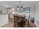 Dining area with warm lighting, a round table, and seamless access to the adjacent kitchen at 3795 Hitchcock Way # 618, Myrtle Beach, SC 29577